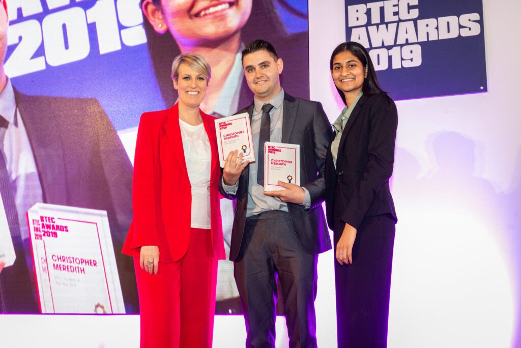 Christopher Meredith receiving the BTEC Award for 19+ Apprentice of the Year and overall BTEC Student of the Year 2019 Award from TV Presenter Steph McGovern (L) and BTEC Student of the Year 2018, Rachna Udasi (R).