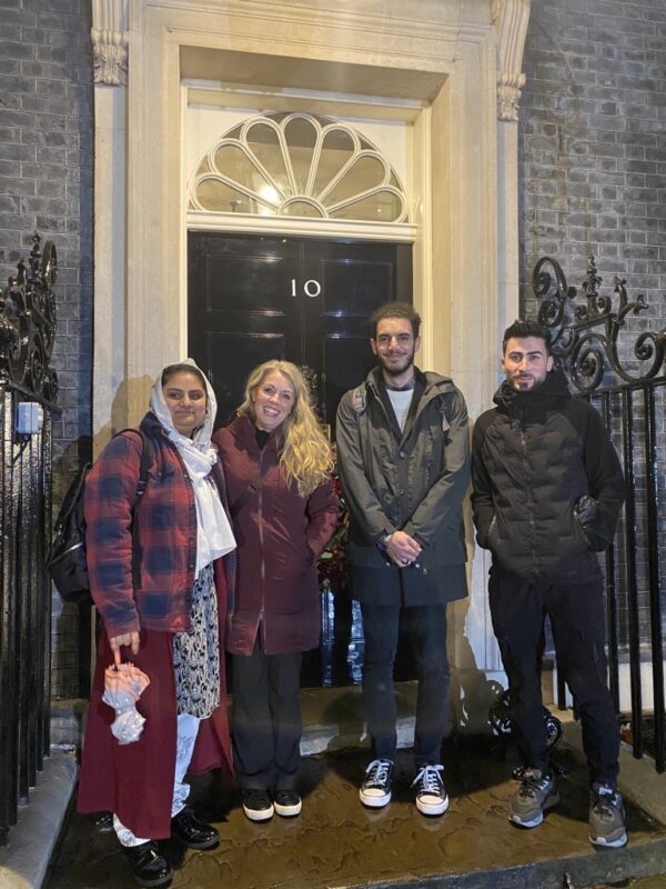 Hajra, Esther, Hareth and Ramin by the door of 10 Downing Street