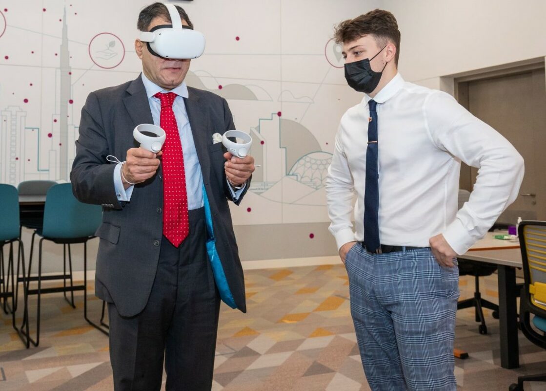 Andy Morrin (right) demonstrates the VR simulator to University of Birmingham Chancellor Lord Karan Bilimoria at the University of Birmingham Dubai campus