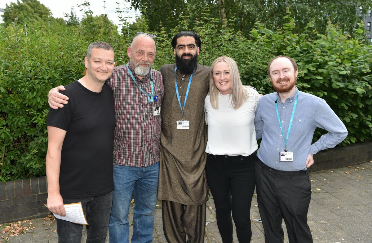 A photo showing three University Centre at Blackburn College students with their two tutors.