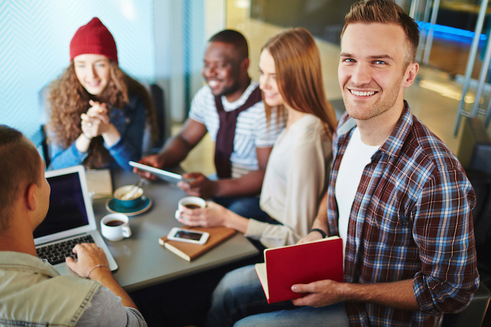 Students sitting around table