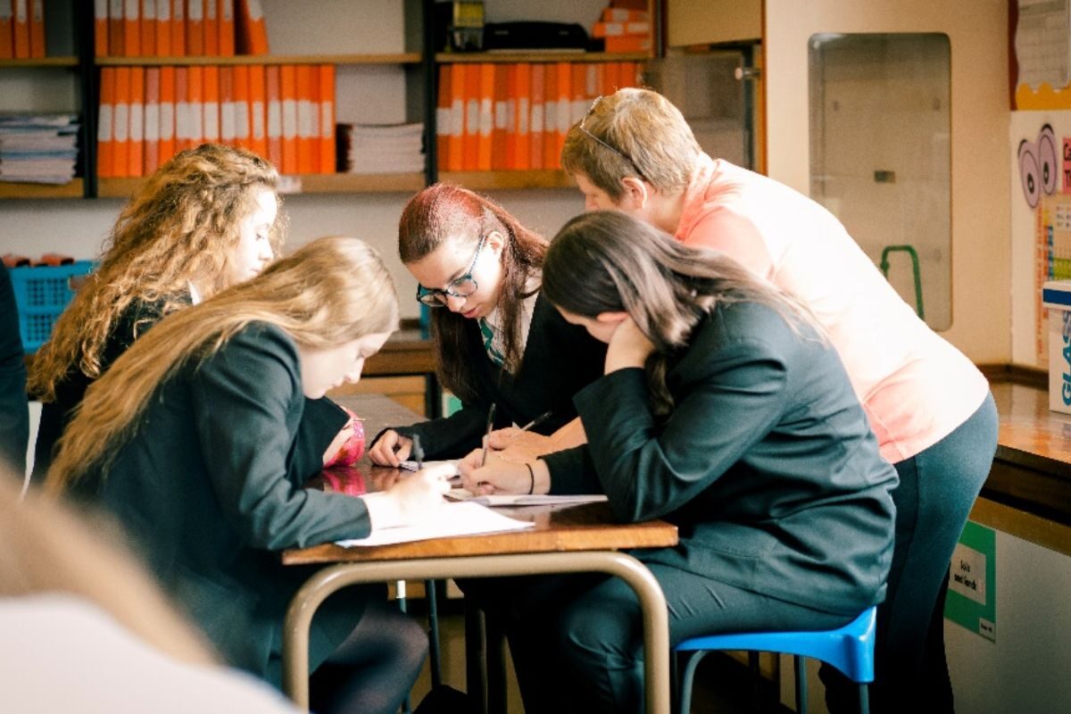 students sat around a desk