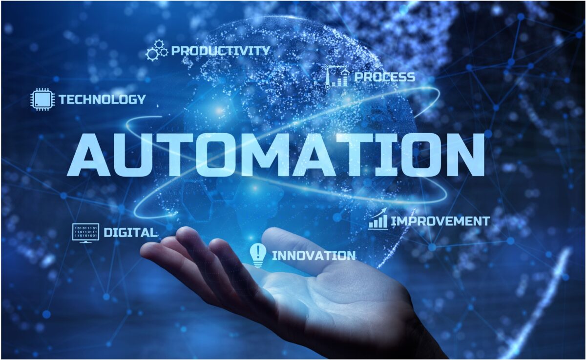 hand with tech and the word 'automation' above it
