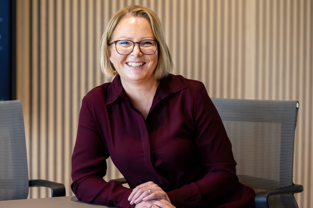 woman sitting down smiling