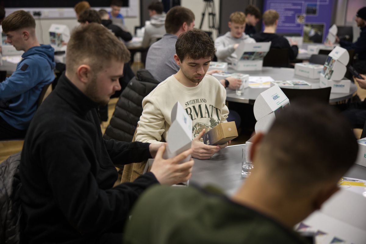 students looking at boxes