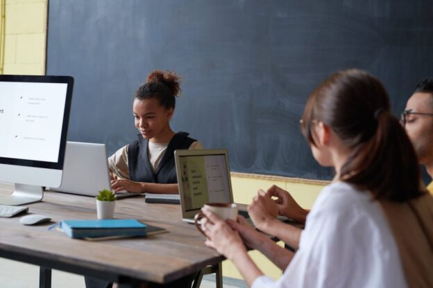 People learning with a laptop in a classroom