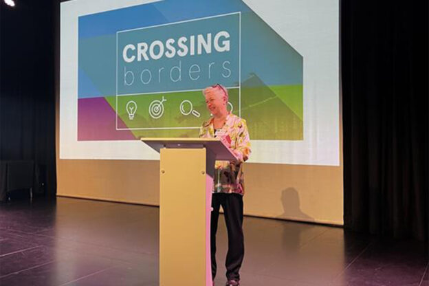 Associate Professor Evelyn Jamieson speaking at a previous Crossing Borders event.
