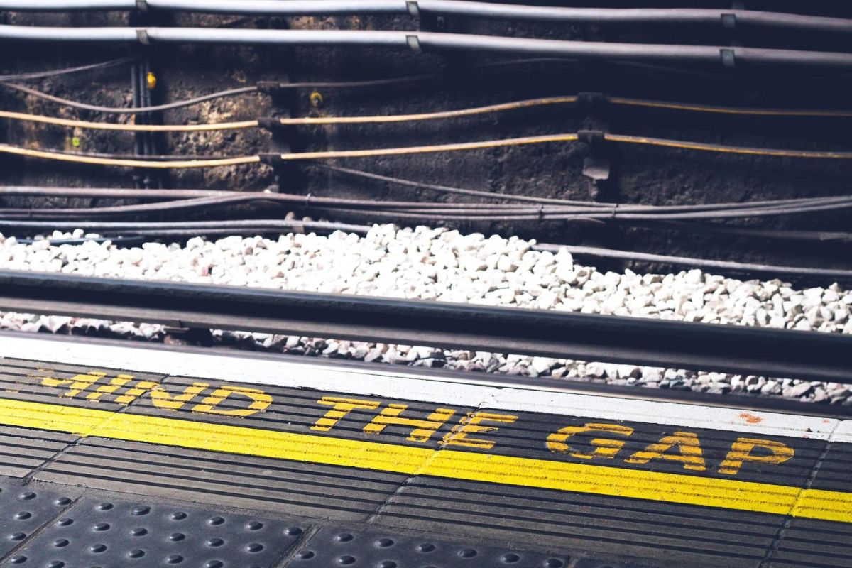 mind the gap tube image, yellow letters on the floor to show the gap between the platform and the train . mindthegap-suad-kamardeen-MYKAZlzW6Nw-unsplash.jpg