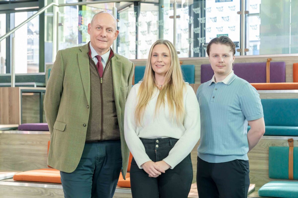 Kurt Dobinson, Fashion Design and Promotion student with Primary Education student Amanda Brannen from the University of Sunderland pictured with David Gray, Chairman of The Sir Tom Cowie Charitable Trust Picture: DAVID WOOD