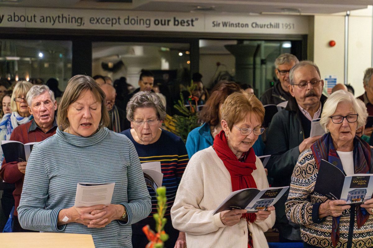 People singing during the Christmas carols service.