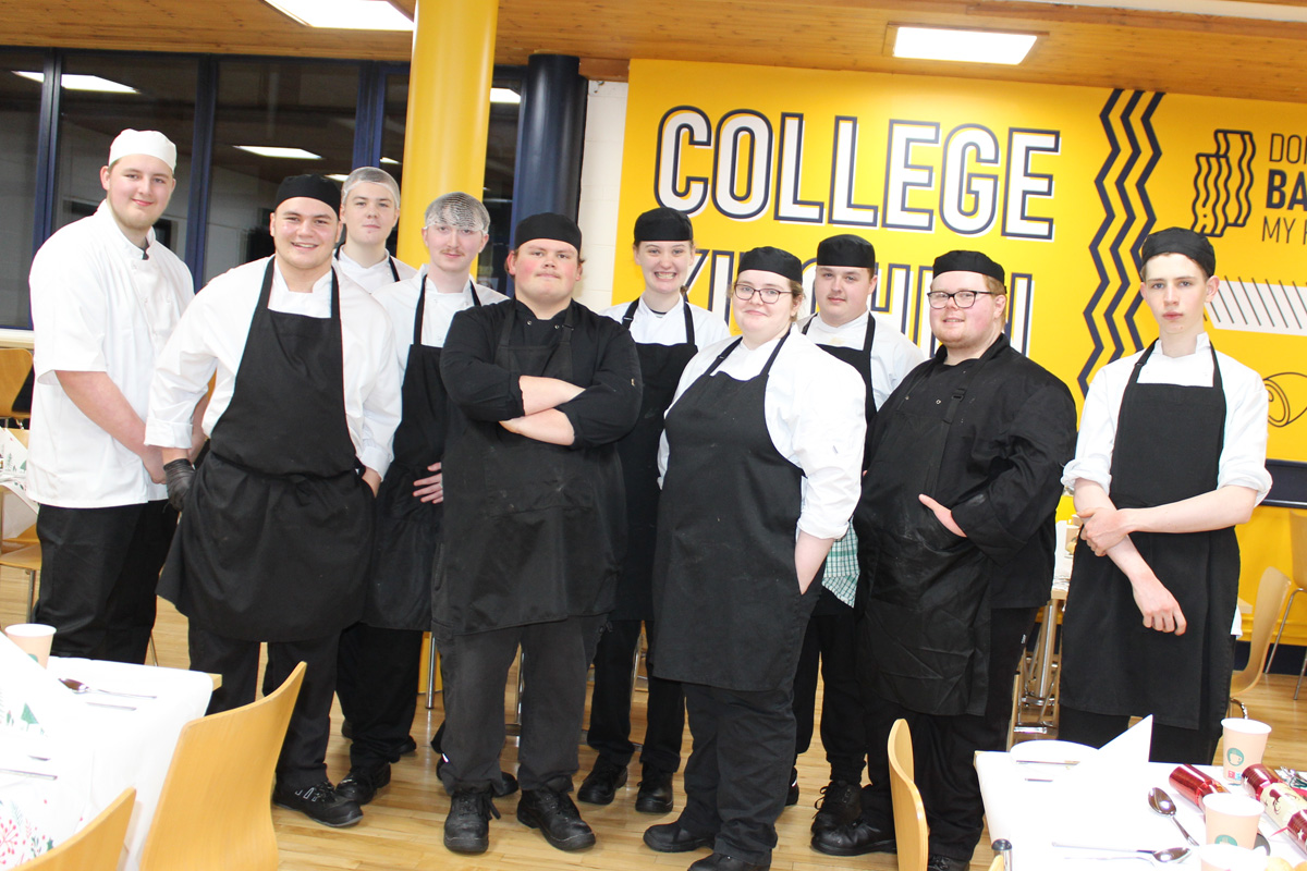 Culinary Arts students in whites and aprons in SERC's College Kitchen