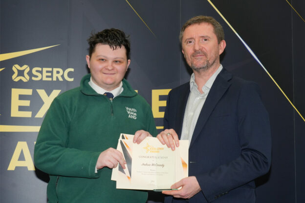 Student receiving award from principal.
