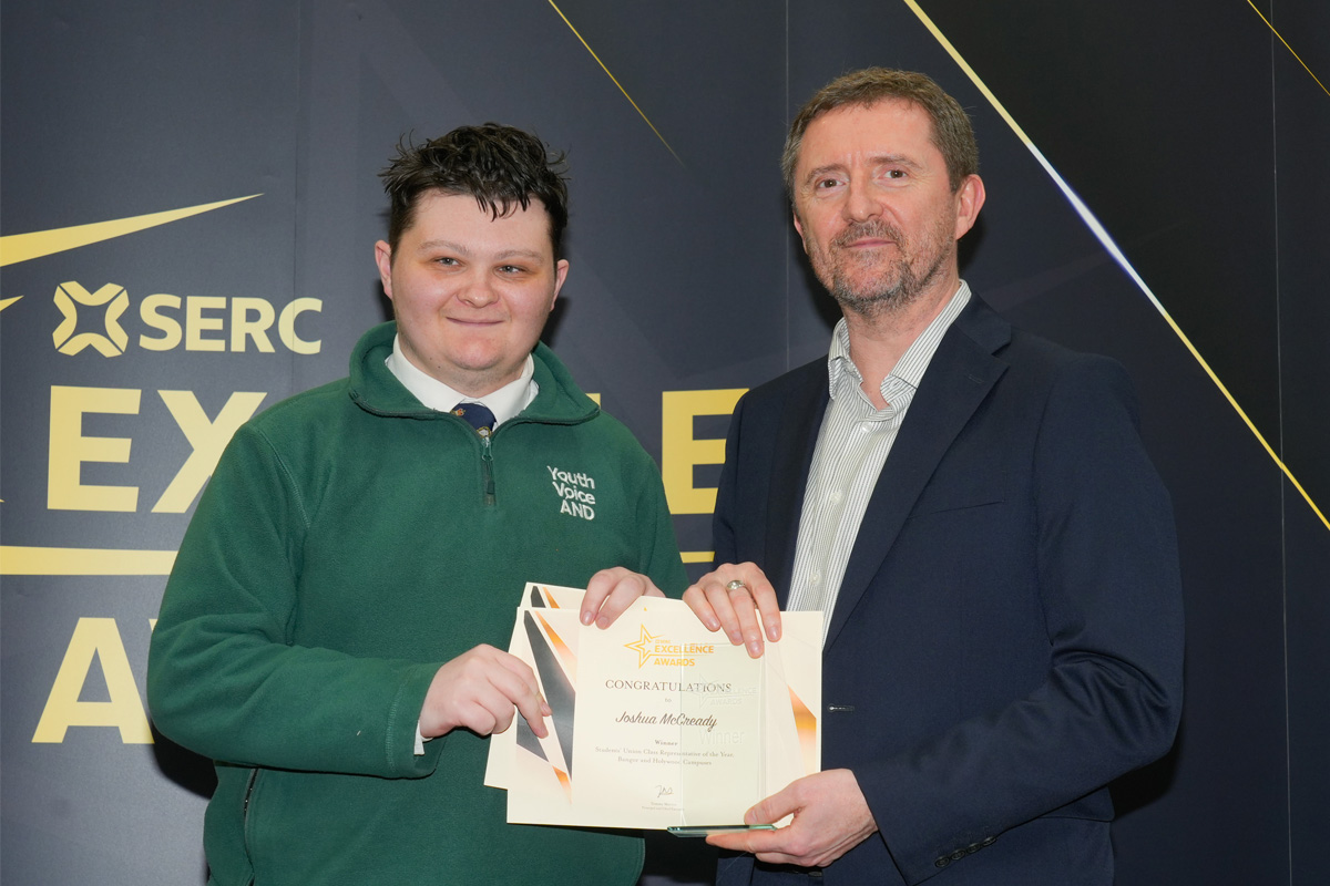 Student receiving award from principal.